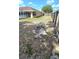 Overgrown backyard surrounded by a privacy fence at 8054 Spring Hill Dr, Spring Hill, FL 34606
