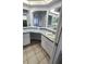 Bathroom featuring a vanity, mirrors, and ceramic tile flooring at 8054 Spring Hill Dr, Spring Hill, FL 34606