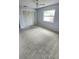 Neutral bedroom with a ceiling fan, closet, and window allowing natural light at 8054 Spring Hill Dr, Spring Hill, FL 34606