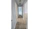 Hallway featuring ceramic tile flooring and light gray walls at 8054 Spring Hill Dr, Spring Hill, FL 34606