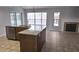 Modern kitchen with stainless steel appliances, granite countertops, and an island with ample counter space at 8054 Spring Hill Dr, Spring Hill, FL 34606