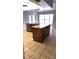 Bright kitchen features tile flooring, granite countertops, stainless steel dishwasher and a spacious island at 8054 Spring Hill Dr, Spring Hill, FL 34606