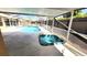 Screened-in lanai with a private pool and spa, perfect for relaxation and entertaining at 8054 Spring Hill Dr, Spring Hill, FL 34606