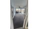 Enclosed sunroom with carpet, ceiling fan, and sliding glass doors to the backyard at 8054 Spring Hill Dr, Spring Hill, FL 34606