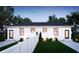 Well-maintained backyard with a white fence, lush green lawn, and landscaped features, creating a serene outdoor space at 807 E Ida St # 1, Tampa, FL 33603