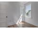 Bedroom with hardwood floors, white walls, and bright natural light at 807 E Ida St # 1, Tampa, FL 33603