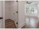 Bedroom with hardwood flooring, a ceiling fan, and walk-in closet at 807 E Ida St # 1, Tampa, FL 33603