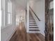 Bright entryway with hardwood floors, wooden stairs, and an open concept layout at 807 E Ida St # 1, Tampa, FL 33603