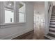 Entryway with hardwood floors, stairs, and open views to living room and kitchen at 807 E Ida St # 1, Tampa, FL 33603