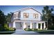 New two-story home showcasing a welcoming front porch with a well-manicured lawn and tasteful landscaping at 807 E Ida St # 1, Tampa, FL 33603