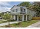 Spacious two-story home showcasing a covered front porch, well-kept lawn, and welcoming exterior design at 807 E Ida St # 1, Tampa, FL 33603