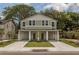 Charming two-story home boasting a covered front porch, well-manicured lawn, and inviting curb appeal at 807 E Ida St # 1, Tampa, FL 33603