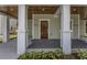 Inviting covered front porch featuring stained wood ceilings and professional landscaping at 807 E Ida St # 1, Tampa, FL 33603