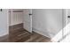 Hallway features hardwood floors, white trim, and natural light at 807 E Ida St # 1, Tampa, FL 33603