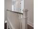 Upstairs hallway with hardwood floors and white wood railing at 807 E Ida St # 1, Tampa, FL 33603