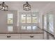 Granite kitchen island, pendant lighting, and double glass doors to the outside at 807 E Ida St # 1, Tampa, FL 33603