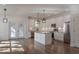 A pristine white kitchen with stainless steel appliances and a stylish island at 807 E Ida St # 1, Tampa, FL 33603