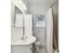 Charming bathroom with black and white tile floor, vintage sink, and natural light at 811 E Flora St, Tampa, FL 33604
