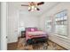 Comfortable bedroom with a ceiling fan, natural light, and a decorative rug for a cozy atmosphere at 811 E Flora St, Tampa, FL 33604