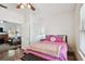 Inviting bedroom featuring a cozy seating area and a glimpse into a well-lit living space at 811 E Flora St, Tampa, FL 33604