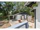 View of the two car garage with additional grilling and brick oven area at 811 E Flora St, Tampa, FL 33604