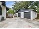 Spacious two-car garage features a large paved driveway and wooden fence at 811 E Flora St, Tampa, FL 33604