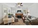 Bright living room featuring a fireplace, hardwood floors and neutral decor at 811 E Flora St, Tampa, FL 33604