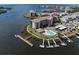 Aerial view of condo building on point with boat docks and swimming pool with waterfront views at 8141 Aquila St # 346, Port Richey, FL 34668