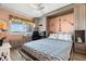 Comfortable bedroom with a murphy bed, built-in shelves, desk space and beautiful view at 8141 Aquila St # 346, Port Richey, FL 34668