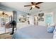 Tranquil bedroom featuring white dresser, comfortable bedding and access to the patio at 8141 Aquila St # 346, Port Richey, FL 34668