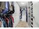 Spacious walk-in closet featuring ample hanging and shelving space for organized storage at 8141 Aquila St # 346, Port Richey, FL 34668