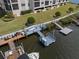 An aerial view showing the dock area, boat slips, and waterfront access for the condo complex at 8141 Aquila St # 346, Port Richey, FL 34668