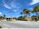 Community entrance featuring a guardhouse, stone wall, and lush landscaping, creating an inviting arrival at 8141 Aquila St # 346, Port Richey, FL 34668