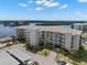 Waterfront condo building featuring convenient covered parking, well maintained landscaping, and water views at 8141 Aquila St # 346, Port Richey, FL 34668
