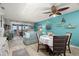 Coastal-themed living and dining area with natural light, balcony access, and comfortable seating at 8141 Aquila St # 346, Port Richey, FL 34668