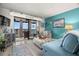 Living room with balcony access offering a scenic view, a comfortable seating area, and stylish decor at 8141 Aquila St # 346, Port Richey, FL 34668