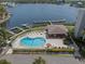 Overhead view of the pool and cabana area with chairs next to waterfront at 8141 Aquila St # 346, Port Richey, FL 34668