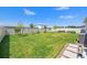 Flat green backyard has lush landscaping and a privacy fence for enjoyment and entertaining at 8919 Drummer Plank Dr, Wesley Chapel, FL 33545