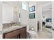 A small window adds natural light to the bathroom and complements the granite countertop at 8919 Drummer Plank Dr, Wesley Chapel, FL 33545