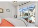 The bed has a scenic view of the pool and back yard through sliding glass doors at 8919 Drummer Plank Dr, Wesley Chapel, FL 33545