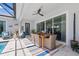 Outdoor dining area on covered patio, seamlessly blending indoor and outdoor living spaces at 8919 Drummer Plank Dr, Wesley Chapel, FL 33545