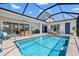 Inviting pool and patio area, perfect for outdoor entertaining and relaxation with Gathering and friends at 8919 Drummer Plank Dr, Wesley Chapel, FL 33545