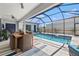 Inviting pool and patio area, perfect for outdoor entertaining and relaxation with Gathering and friends at 8919 Drummer Plank Dr, Wesley Chapel, FL 33545