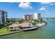Expansive condo buildings with clubhouse and pool on a waterfront property with manicured landscaping at 9525 Blind Pass Rd # 508, St Pete Beach, FL 33706