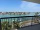 Balcony view showcasing waterfront, city, and blue skies at 9525 Blind Pass Rd # 508, St Pete Beach, FL 33706