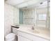 The bathroom offers a modern toilet and vanity with an expansive mirror at 9525 Blind Pass Rd # 508, St Pete Beach, FL 33706