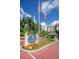 The entrance to Yacht & Tennis Club of St. Pete Beach is marked by colorful flowers and flags at 9525 Blind Pass Rd # 508, St Pete Beach, FL 33706