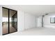 Spacious living room with sliding glass door to balcony and water views at 9525 Blind Pass Rd # 508, St Pete Beach, FL 33706