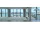 Living space featuring great water views, leading to an outdoor balcony at 9525 Blind Pass Rd # 508, St Pete Beach, FL 33706
