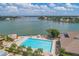 Relaxing community pool with lounge chairs and stunning water views at 9525 Blind Pass Rd # 508, St Pete Beach, FL 33706